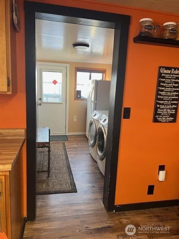 79 Duck Lake Rd, Omak, WA 98841 - laundry room featuring washer and clothes dryer and dark wood finished floors