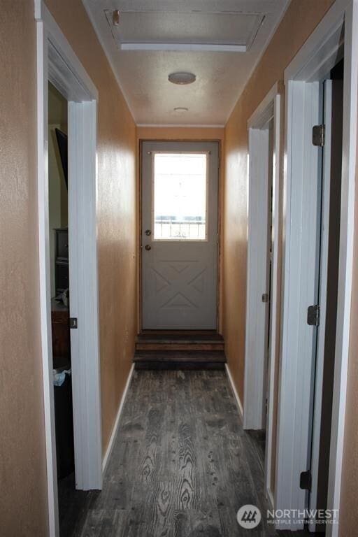 79 Duck Lake Rd, Omak, WA 98841 - doorway featuring dark wood finished floors and baseboards