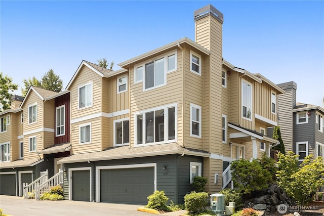 16107 NE 90th Way Unit 3304, Redmond, WA 98052 - view of building exterior featuring a garage and driveway