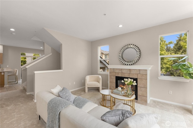 16107 NE 90th Way Unit 3304, Redmond, WA 98052 - living area with light carpet, a tiled fireplace, and recessed lighting
