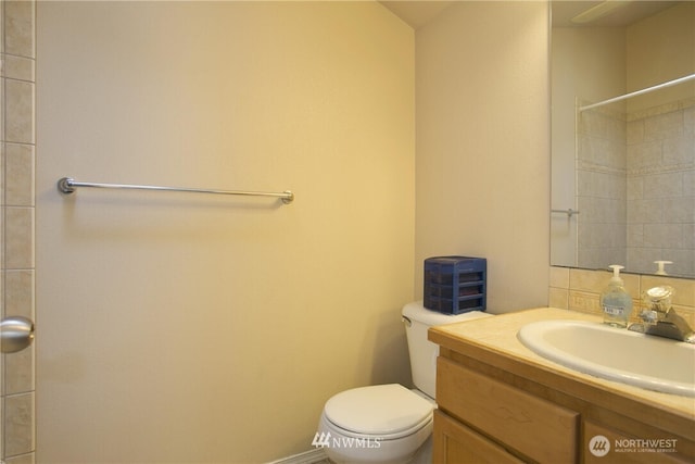 5223 11th Ave NE Unit A, Seattle, WA 98105 - bathroom featuring vanity, a shower, and decorative backsplash