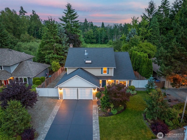 21227 SE 29th St, Sammamish, WA 98075 - traditional-style home with an attached garage, concrete driveway, a chimney, and roof with shingles