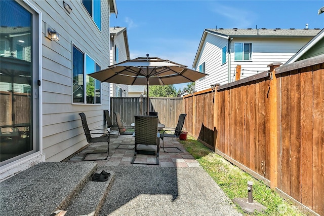 4023 Tribute Ave E, Fife, WA 98424 - fenced backyard with a patio area
