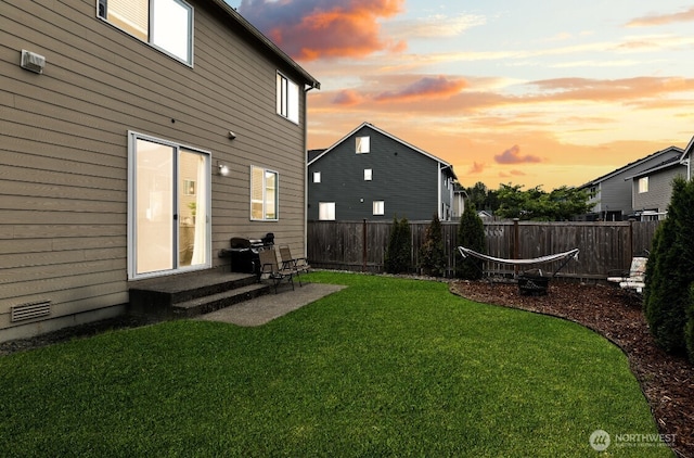14410 99th Way SE, Yelm, WA 98597 - yard at dusk with a fenced backyard