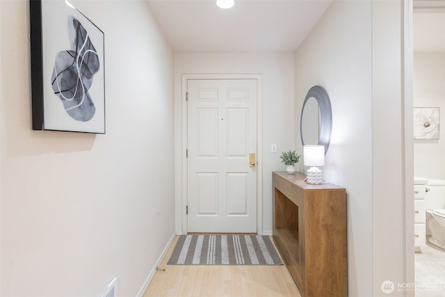 2241 13th Ave W, Seattle, WA 98119 - doorway featuring wood finished floors and baseboards