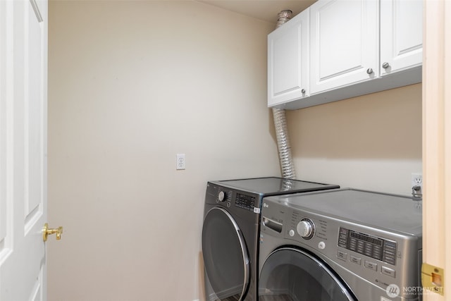 2241 13th Ave W, Seattle, WA 98119 - washroom featuring cabinet space and separate washer and dryer