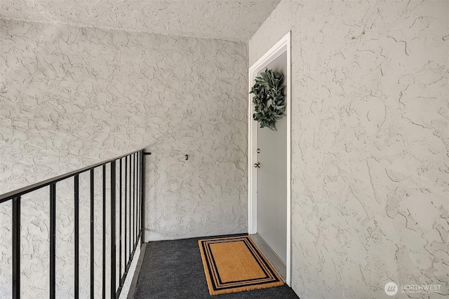 12023 100th Ave NE Unit C4, Kirkland, WA 98034 - property entrance with a balcony and stucco siding