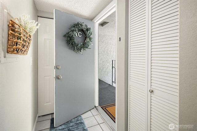 12023 100th Ave NE Unit C4, Kirkland, WA 98034 - hallway with a textured ceiling and light tile patterned floors