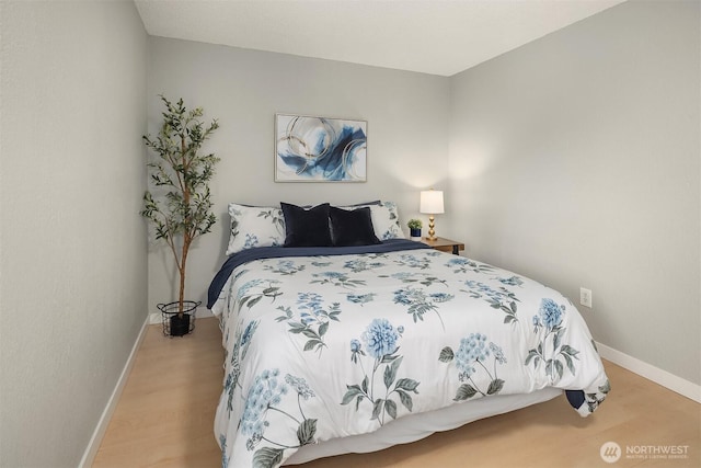 12023 100th Ave NE Unit C4, Kirkland, WA 98034 - bedroom with baseboards and light wood-style floors