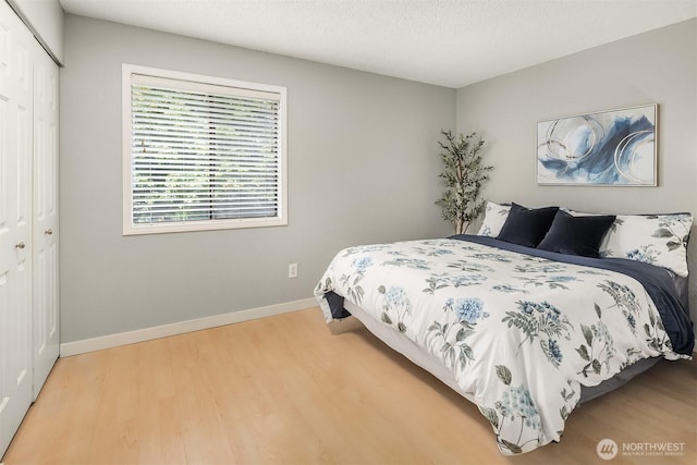 12023 100th Ave NE Unit C4, Kirkland, WA 98034 - bedroom with a closet and light wood-type flooring