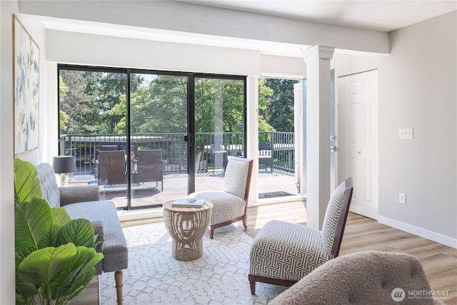 8845 166th Ave NE Unit B101, Redmond, WA 98052 - living room featuring wood finished floors and decorative columns
