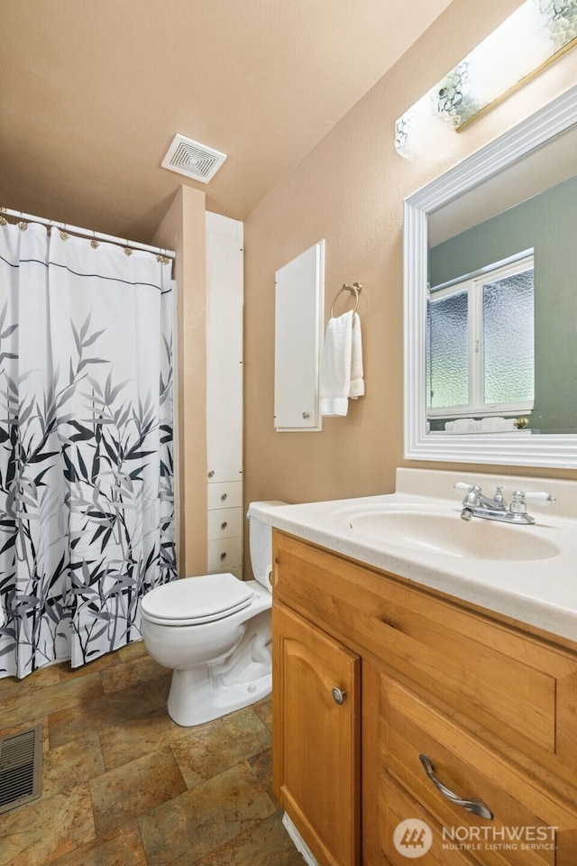 14531 262nd Ave SE, Issaquah, WA 98027 - bathroom featuring vanity, stone finish floors, and a shower with curtain