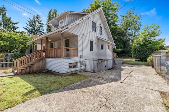 6719 46th Ave S, Seattle, WA 98118 - view of front of property with concrete driveway, a porch, and stairway