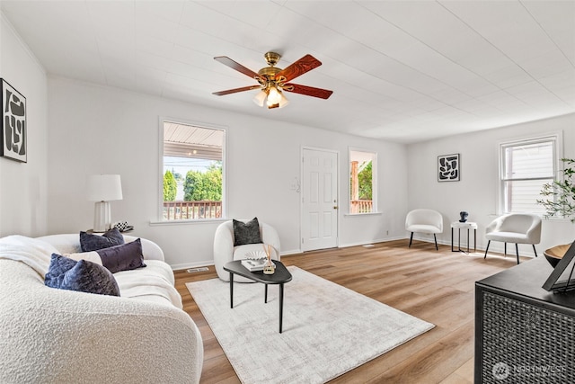 6719 46th Ave S, Seattle, WA 98118 - living area with a ceiling fan and light wood-style floors