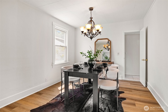 6719 46th Ave S, Seattle, WA 98118 - dining area with a chandelier and light wood finished floors