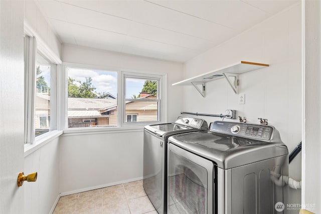 6719 46th Ave S, Seattle, WA 98118 - laundry area with washer and clothes dryer and light tile patterned flooring