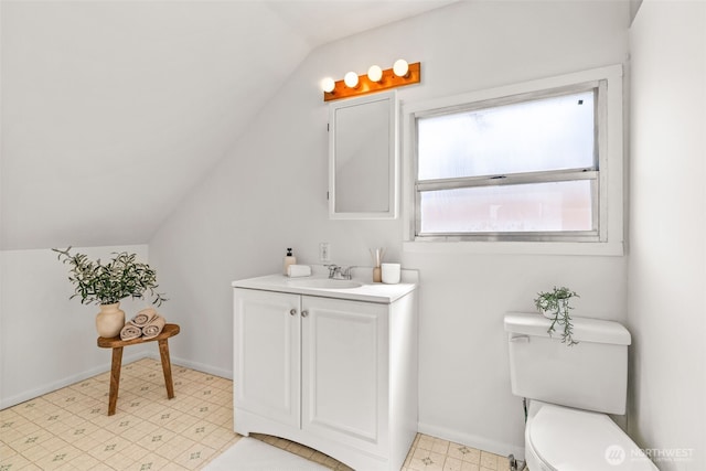 6719 46th Ave S, Seattle, WA 98118 - bathroom with vaulted ceiling, vanity, and tile patterned floors