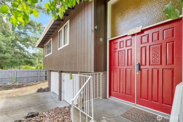 1102 Tule Lake Rd S, Tacoma, WA 98444 - property entrance with an attached garage and concrete driveway