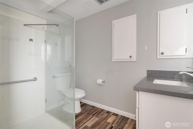 1102 Tule Lake Rd S, Tacoma, WA 98444 - bathroom featuring vanity, wood finished floors, and walk in shower