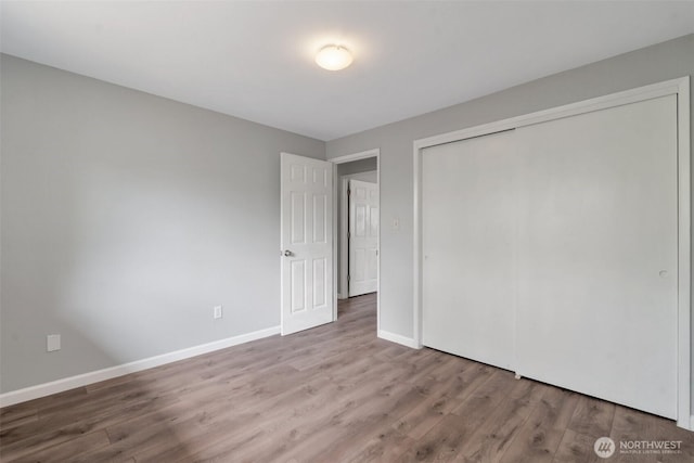 1102 Tule Lake Rd S, Tacoma, WA 98444 - unfurnished bedroom featuring wood finished floors and a closet