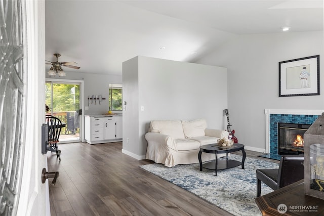 1521 90th Dr NE, Lake Stevens, WA 98258 - living area with wood finished floors, a tile fireplace, lofted ceiling, and ceiling fan