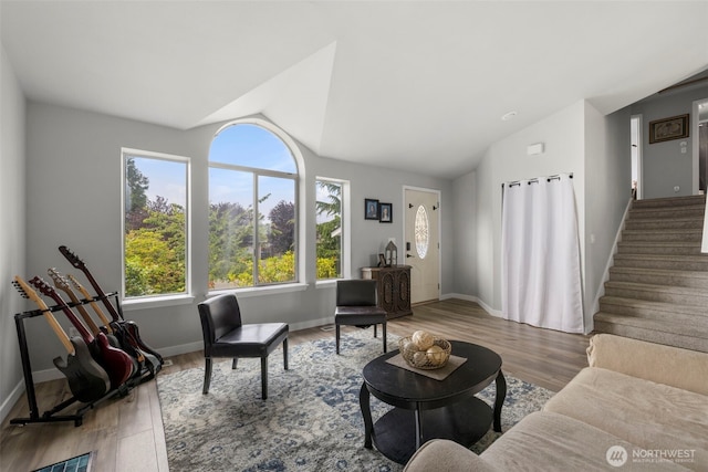 1521 90th Dr NE, Lake Stevens, WA 98258 - living area with vaulted ceiling, wood finished floors, and stairs