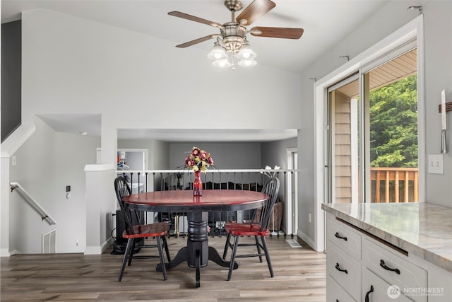 1521 90th Dr NE, Lake Stevens, WA 98258 - dining room featuring light wood-style flooring, a ceiling fan, and lofted ceiling