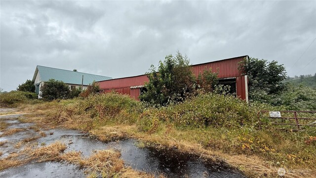 57 Covered Bridge Rd, Grays River, WA 98621 - view of side of home featuring an outbuilding