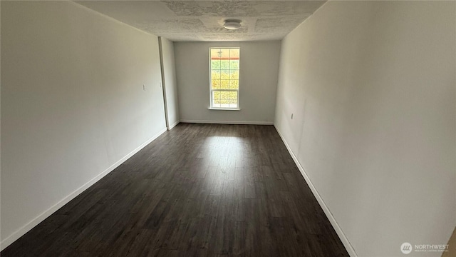 57 Covered Bridge Rd, Grays River, WA 98621 - empty room featuring dark wood-style floors and baseboards