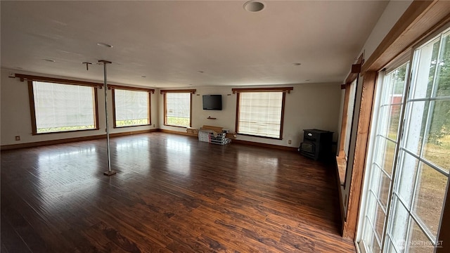 57 Covered Bridge Rd, Grays River, WA 98621 - unfurnished living room featuring wood finished floors and a wood stove