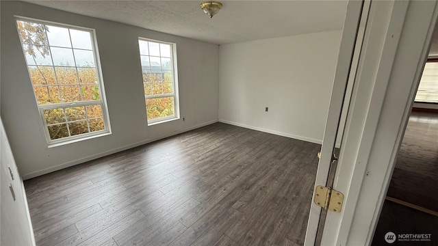 57 Covered Bridge Rd, Grays River, WA 98621 - empty room with dark wood finished floors and baseboards