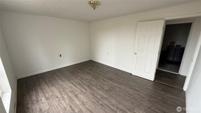 57 Covered Bridge Rd, Grays River, WA 98621 - unfurnished room with dark wood finished floors and baseboards