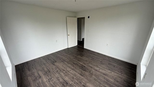 57 Covered Bridge Rd, Grays River, WA 98621 - spare room featuring dark wood-type flooring and baseboards