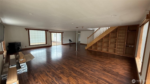 57 Covered Bridge Rd, Grays River, WA 98621 - unfurnished living room featuring wood finished floors, stairs, a wood stove, and recessed lighting
