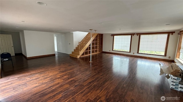 57 Covered Bridge Rd, Grays River, WA 98621 - unfurnished living room with dark wood-type flooring and stairs