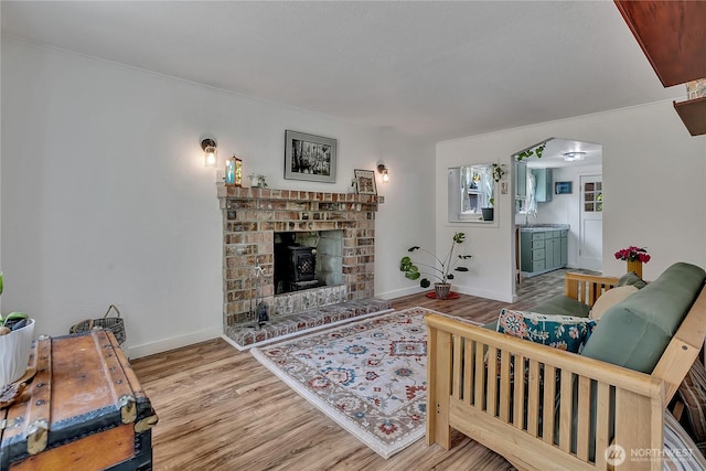 1400 Baby Doll Rd SE, Port Orchard, WA 98366 - living area with wood finished floors, arched walkways, and a fireplace