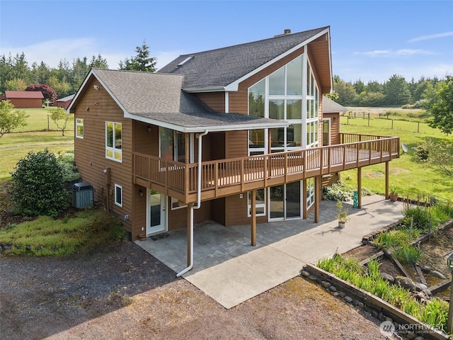 107 Gilbert Rd N, Onalaska, WA 98570 - back of house with a patio area, a deck, and roof with shingles