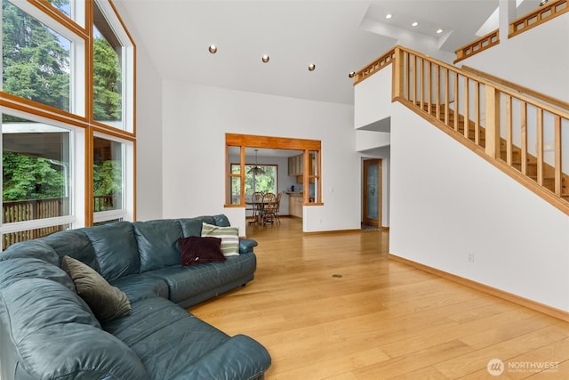 107 Gilbert Rd N, Onalaska, WA 98570 - living room with a high ceiling, recessed lighting, light wood-style floors, and stairs