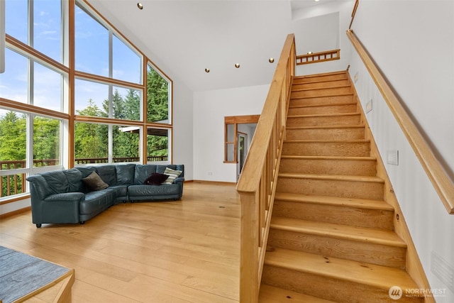 107 Gilbert Rd N, Onalaska, WA 98570 - staircase with high vaulted ceiling and hardwood / wood-style floors