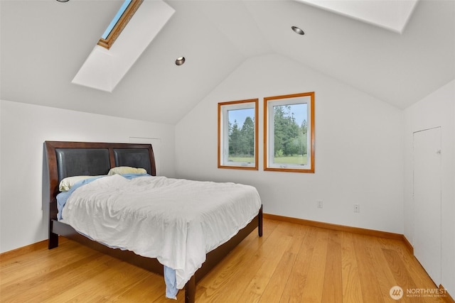 107 Gilbert Rd N, Onalaska, WA 98570 - bedroom with a skylight, light wood-type flooring, and vaulted ceiling