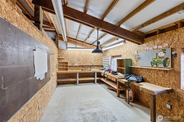 107 Gilbert Rd N, Onalaska, WA 98570 - miscellaneous room featuring a workshop area, lofted ceiling, and concrete flooring