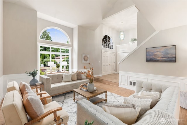 1514 232nd Pl SW, Bothell, WA 98021 - living room with light wood finished floors, a wainscoted wall, and a high ceiling