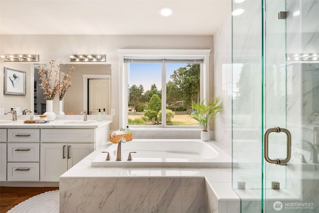 1514 232nd Pl SW, Bothell, WA 98021 - bathroom featuring double vanity, a garden tub, a marble finish shower, healthy amount of natural light, and recessed lighting