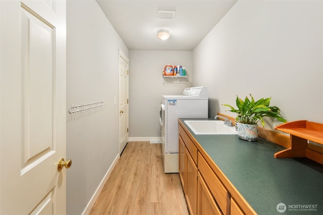 1514 232nd Pl SW, Bothell, WA 98021 - washroom with separate washer and dryer and light wood-type flooring
