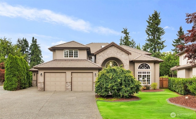1514 232nd Pl SW, Bothell, WA 98021 - view of front of house with a tile roof, asphalt driveway, and stone siding