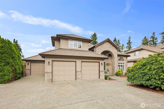 1514 232nd Pl SW, Bothell, WA 98021 - view of front of house with a tiled roof, brick siding, driveway, and an attached garage