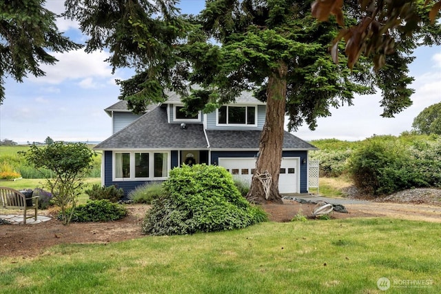 179 Perry Dr, Coupeville, WA 98239 - view of front of house featuring roof with shingles, driveway, a front lawn, and an attached garage