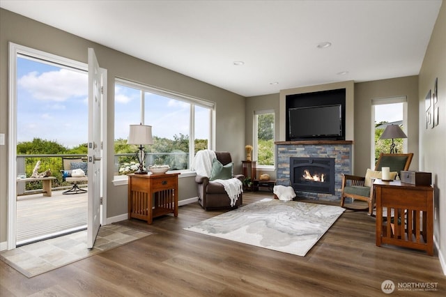 179 Perry Dr, Coupeville, WA 98239 - living room with a stone fireplace, wood finished floors, and recessed lighting