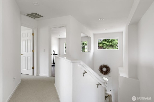 179 Perry Dr, Coupeville, WA 98239 - hallway featuring an upstairs landing and light colored carpet