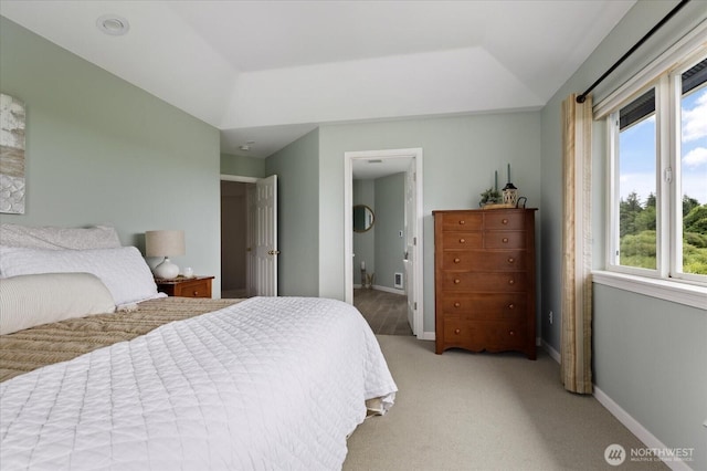 179 Perry Dr, Coupeville, WA 98239 - bedroom featuring multiple windows, light carpet, and ensuite bath